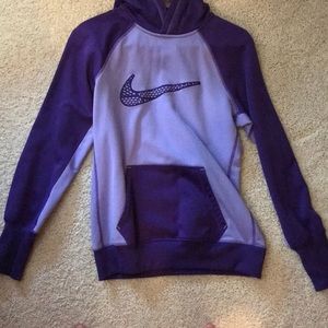 A purple Nike therma fit sweatshirt